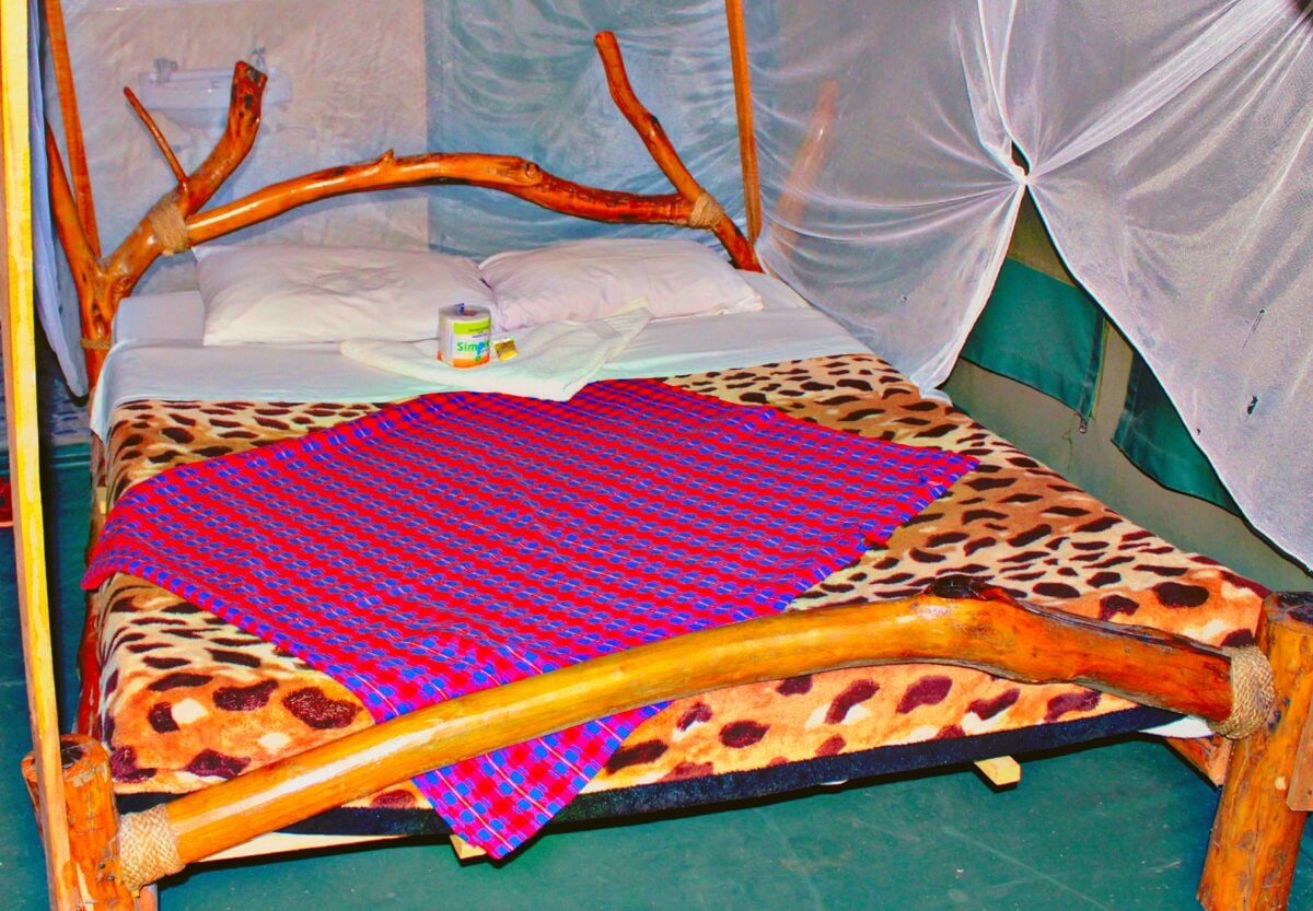 Olailepo Mara Camp rustic bed